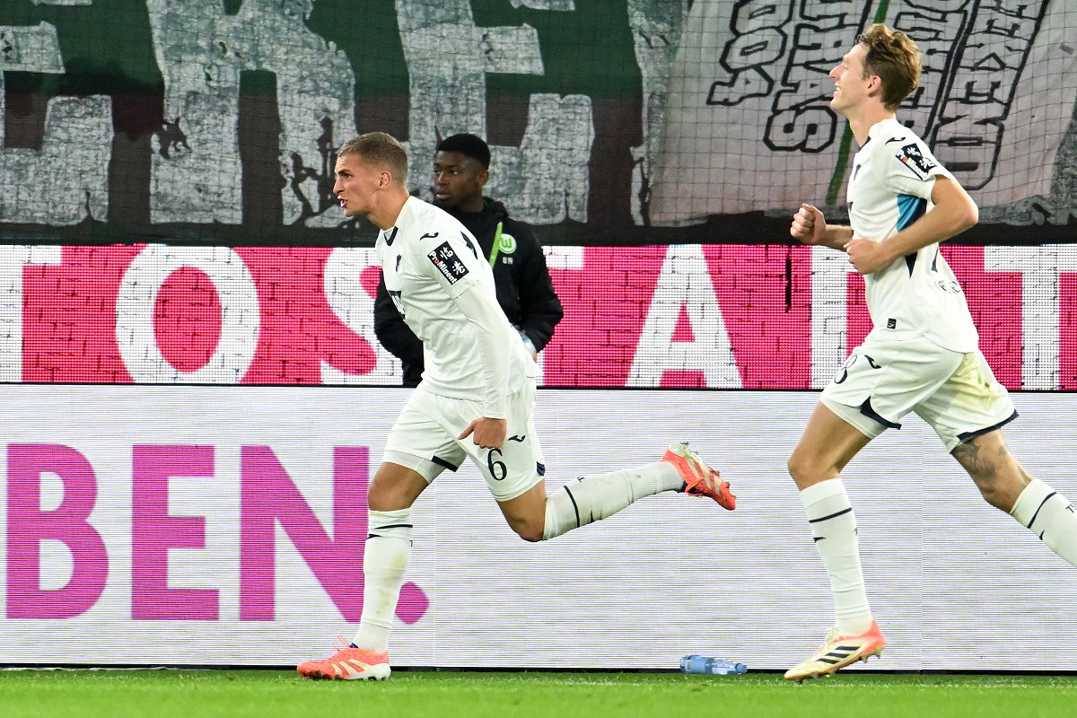 Hoffenheim's Grischa Prömel, left, celebrates scoring during the Bundesliga soccer match between VfL Wolfsburg - TSG Hoffenheim in Wolfsburg, Germany, Sunday Nov. 2, 2025. (Swen Pförtner/dpa via AP)