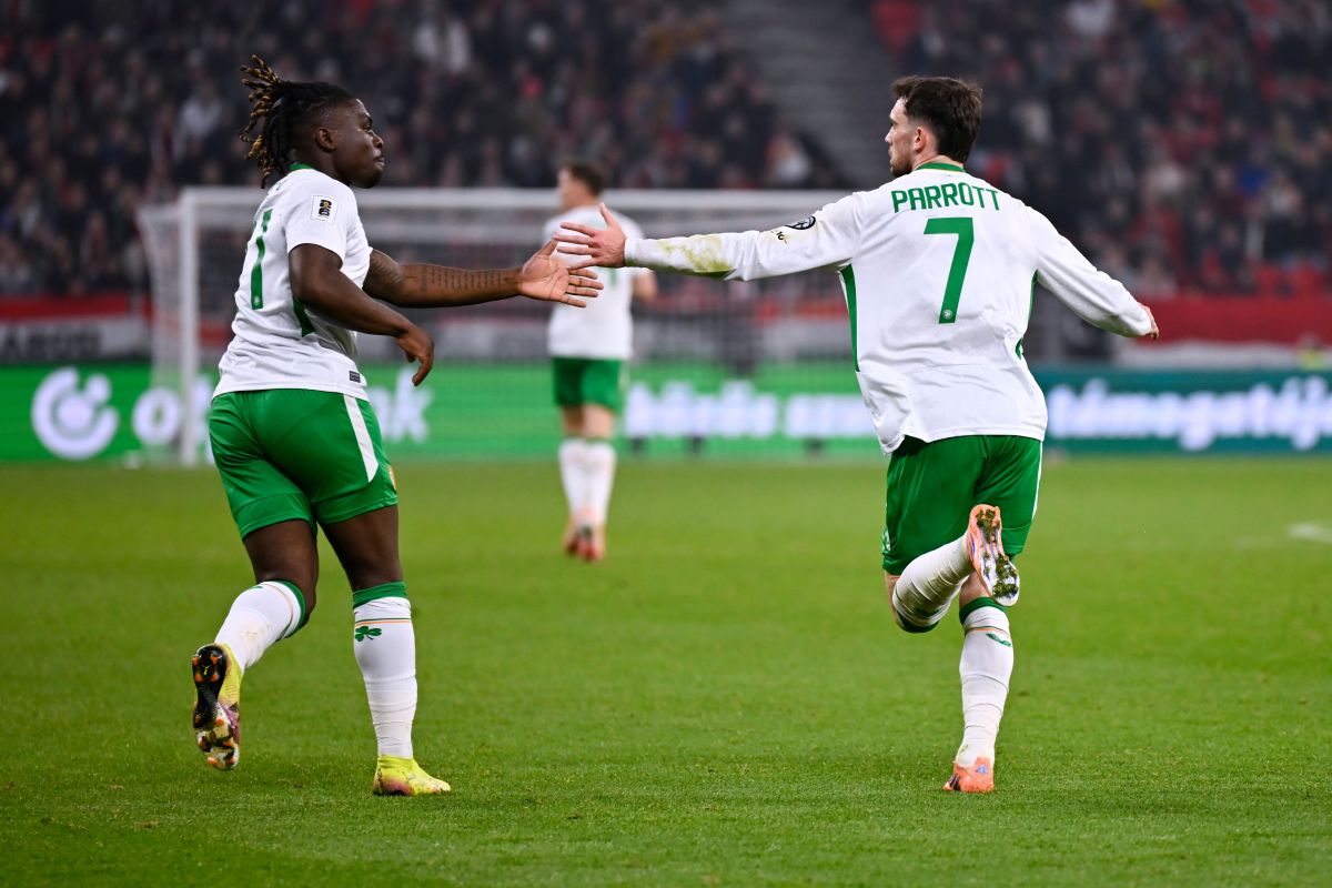 Ireland's Troy Parrott, right, celebrates after scoring his side's second goal during the World Cup 2026 group F qualifying soccer match between Hungary and Ireland in Budapest, Hungary, Sunday, Nov. 16, 2025. (AP Photo/Denes Erdos)