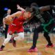 Los Angeles Clippers Bogdan Bogdanovic drives against Boston Celtics center Neemias Queta during the first half of an NBA basketball game, Sunday, Nov. 16, 2025, in Boston. (AP Photo/Robert F. Bukaty)