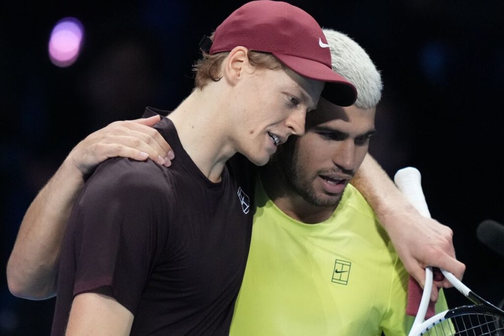 Italy's Jannik Sinner, left, and Spain's Carlos Alcaraz hug after the final tennis match of the ATP World Tour Finals, in Turin, Italy, Sunday, Nov. 16, 2025. (AP Photo/Antonio Calanni)