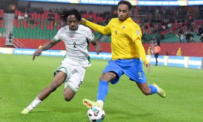 Nigeria's Benjamin Fredrick, left, and Gabon's Pierre-Emerick Aubameyang challenge for the ball during the World Cup 2026 African qualifying semi-final soccer match between Nigeria and Gabon, in Rabat, Morocco, Thursday, Nov. 13, 2025. (AP Photo)