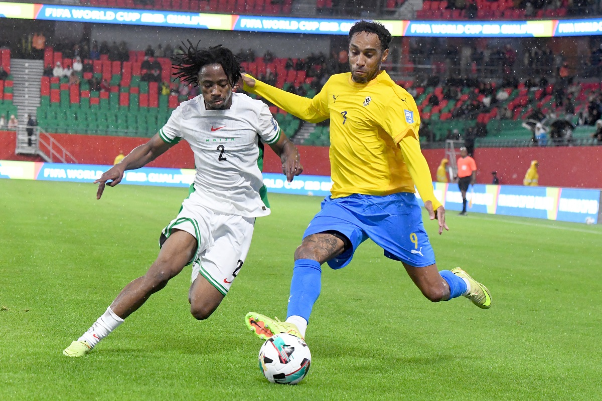 Nigeria's Benjamin Fredrick, left, and Gabon's Pierre-Emerick Aubameyang challenge for the ball during the World Cup 2026 African qualifying semi-final soccer match between Nigeria and Gabon, in Rabat, Morocco, Thursday, Nov. 13, 2025. (AP Photo)