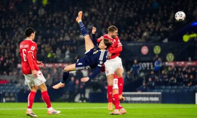 Scotland's Scott McTominay scores the opening goal during the 2026 World Cup European Qualifying soccer match between Scotland and Denmark at Hampden Park, Glasgow, Scotland, Tuesday, Nov. 18, 2025. (Andrew Milligan/PA via AP)