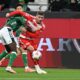 Bremen's Karim Coulibaly, left, and Berlin's Andrej Ilic in action during the Bundesliga soccer match between FC Union Berlin, Matchday 8, at Weserstadion in Bremen, Germany, Friday Oct. 24, 2025. (Carmen Jaspersen/dpa via AP)