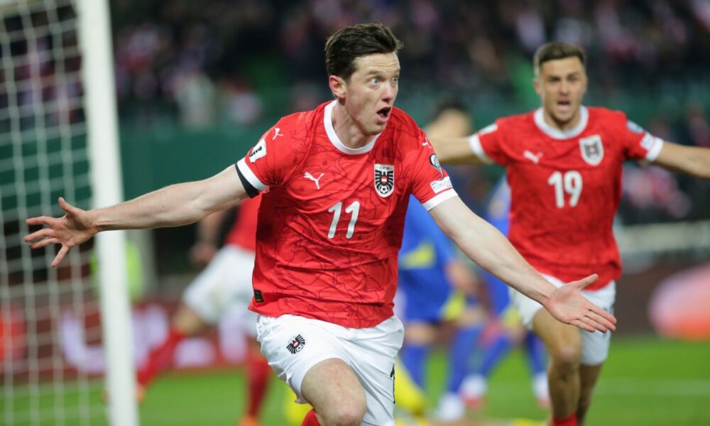 Austria's Michael Gregoritsch celebrates his side's equalizing goal during a group H World Cup qualifiying soccer match between Austria and Bosnia and Herzegovina in Vienna, Austria, Tuesday, Nov. 18, 2025. (AP Photo/Heinz-Peter Bader)