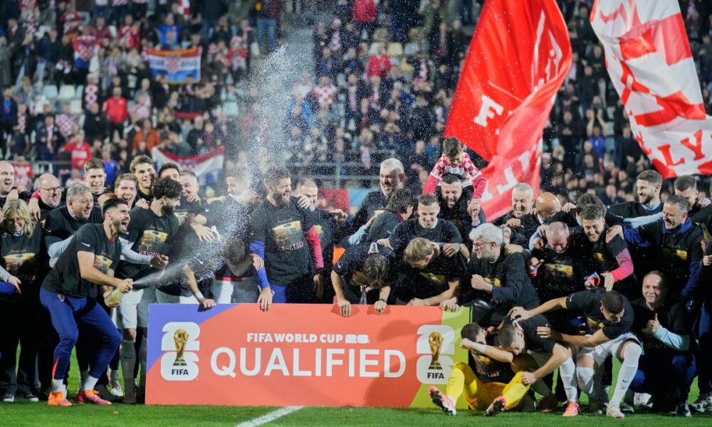 Croat players celebret as they qualified for the World Cup aftre defeating Faroe Islands in Rijeka, Croatia, Friday, Nov. 14, 2025. (AP Photo/Darko Bandic)