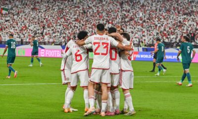UAE players celebrate after their teammate Luan Pereira scored his side's opening goal during the 2026 World Cup play off first leg soccer match between UAE and Iraq in Abu Dhabi, United Arab Emirates, Thursday, Nov. 13, 2025. (AP Photo/Walid Ibrahim)