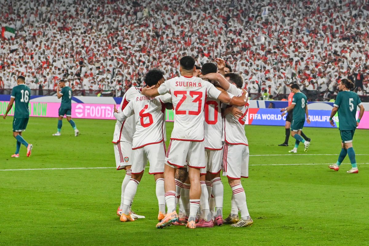 UAE players celebrate after their teammate Luan Pereira scored his side's opening goal during the 2026 World Cup play off first leg soccer match between UAE and Iraq in Abu Dhabi, United Arab Emirates, Thursday, Nov. 13, 2025. (AP Photo/Walid Ibrahim)
