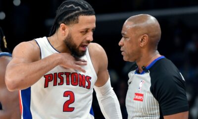 Detroit Pistons guard Cade Cunningham (2) talks to referee Tre Maddox (23) in the first half of an NBA basketball game Monday, Nov. 3, 2025, in Memphis, Tenn. (AP Photo/Brandon Dill)
