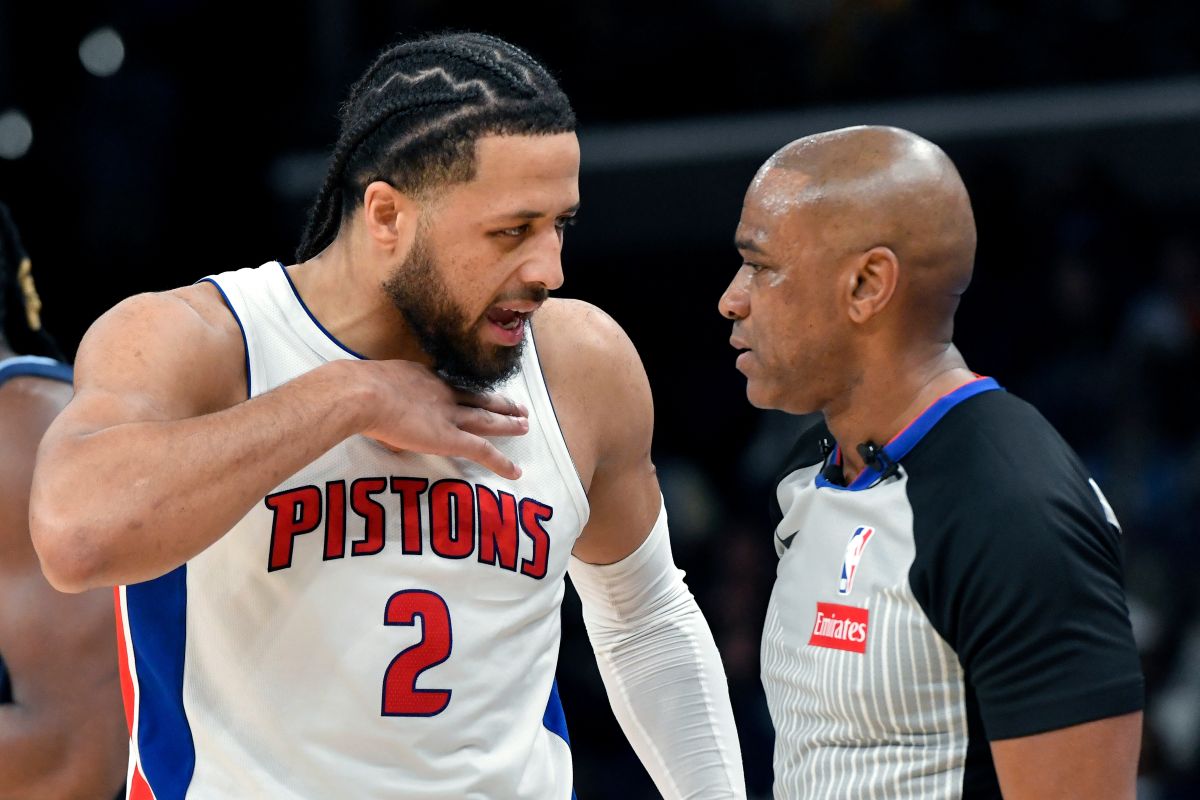 Detroit Pistons guard Cade Cunningham (2) talks to referee Tre Maddox (23) in the first half of an NBA basketball game Monday, Nov. 3, 2025, in Memphis, Tenn. (AP Photo/Brandon Dill)