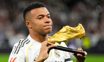 Real Madrid's Kylian Mbappe poses with the Golden Boot award before the Spanish La Liga soccer match between Real Madrid and Valencia in Madrid, Spain, Saturday, Nov. 1, 2025. (AP Photo/Manu Fernandez)