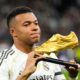 Real Madrid's Kylian Mbappe poses with the Golden Boot award before the Spanish La Liga soccer match between Real Madrid and Valencia in Madrid, Spain, Saturday, Nov. 1, 2025. (AP Photo/Manu Fernandez)