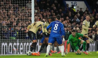 Barcelona's Jules Kounde, second left, scored an own goal during the Champions League opening phase soccer match between Chelsea and Barcelona in London, Tuesday, Nov. 25, 2025. (AP Photo/Kin Cheung)