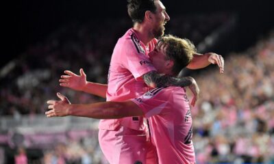 Inter Miami forward Lionel Messi, top, celebrates with forward Mateo Silvetti, bottom, after scoring during the first half of Game 3 in the first round of MLS soccer's Western Conference playoffs against Nashville SC in Fort Lauderdale, Fla., Nov. 8, 2025. (AP Photo/Michael Laughlin)