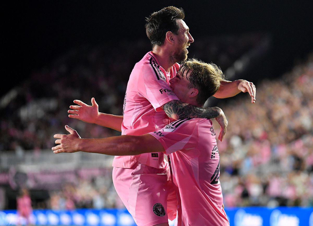 Inter Miami forward Lionel Messi, top, celebrates with forward Mateo Silvetti, bottom, after scoring during the first half of Game 3 in the first round of MLS soccer's Western Conference playoffs against Nashville SC in Fort Lauderdale, Fla., Nov. 8, 2025. (AP Photo/Michael Laughlin)