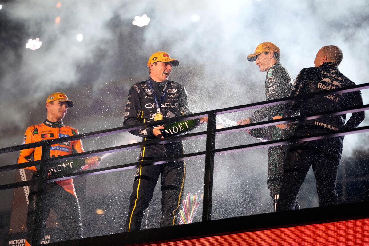 From left, second place finisher McLaren driver Lando Norris of Great Britain, first place finisher Red Bull driver Max Verstappen of the Netherlands, and third place finisher Mercedes driver George Russell of Great Britain celebrate after the Formula One Las Vegas Grand Prix auto race, Saturday, Nov. 22, 2025 in Las Vegas. (AP Photo/John Locher)