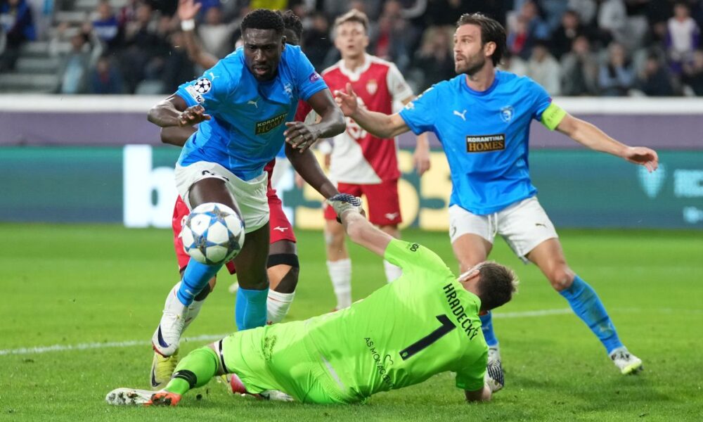 Pafos' Derrick Luckassen, left, in action against Monaco's goalkeeper Lukas Hradecky during the Champions League opening phase soccer match between Pafos FC and AS Monaco in Limassol, Cyprus, Wednesday, Nov. 26, 2025. (AP Photo/Petros Karadjias)