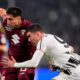 Torino's Guillermo Maripan, left, fights for the ball with Juventus' Dusan Vlahovic during the Serie A soccer match between Juventus and Torino, in Turin, Italy, Saturday, Nov. 8, 2025. (Fabio Ferrari/LaPresse via AP)