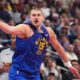 Denver Nuggets center Nikola Jokić argues for a call in the second half of an NBA Cup basketball game against the San Antonio Spurs Friday, Nov. 28, 2025, in Denver. (AP Photo/David Zalubowski)