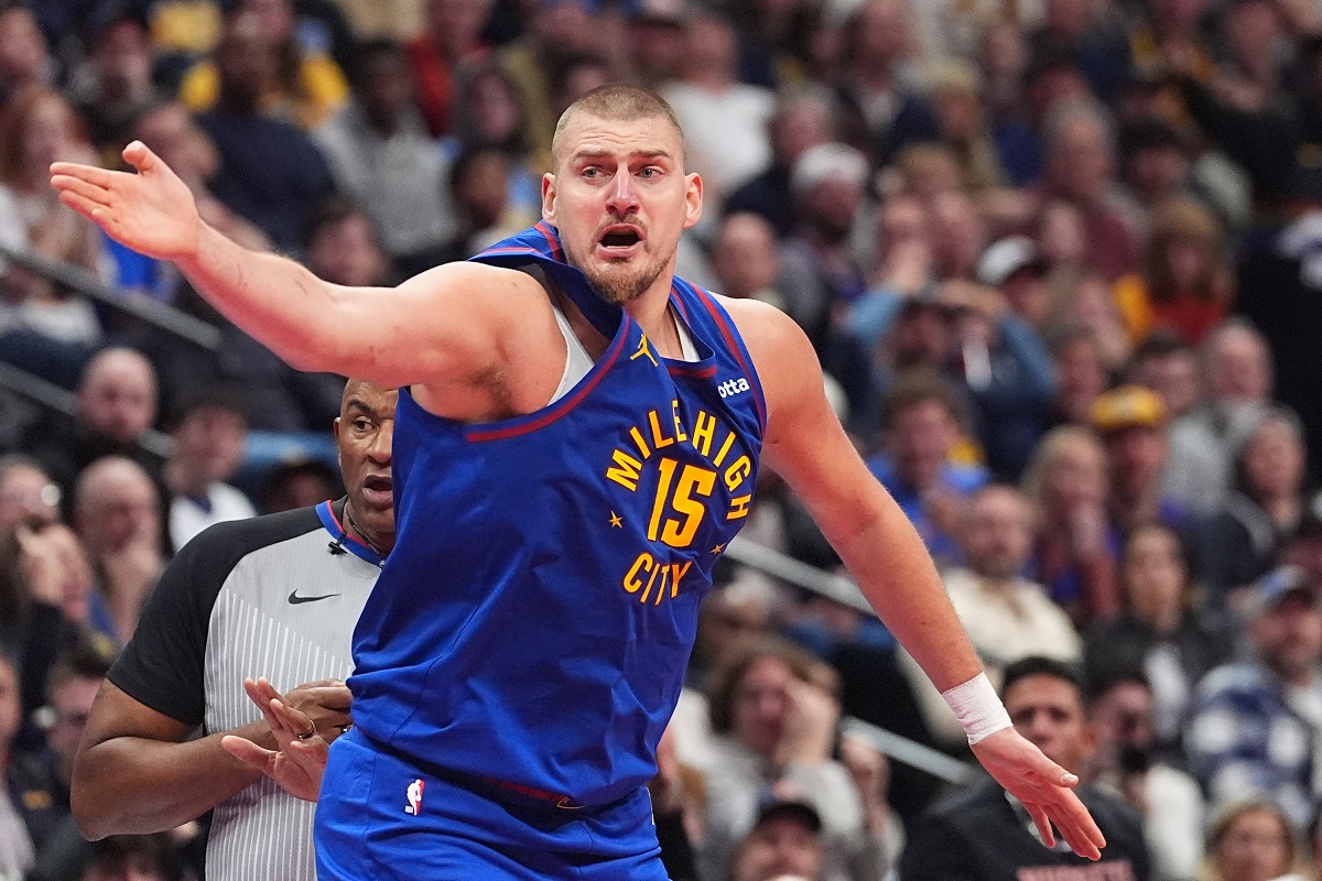 Denver Nuggets center Nikola Jokić argues for a call in the second half of an NBA Cup basketball game against the San Antonio Spurs Friday, Nov. 28, 2025, in Denver. (AP Photo/David Zalubowski)