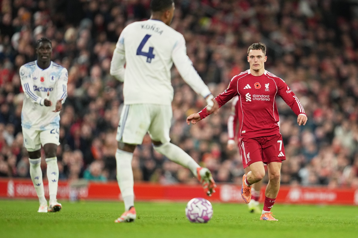 Liverpool's Florian Wirtz, right, and Aston Villa's Ezri Konsa, centre, in action during the English Premier League soccer match between Liverpool and Aston Villa in Liverpool, England, Saturday, Nov. 1, 2025. (AP Photo/Jon Super)