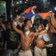 FILE - Fans celebrate Haiti defeating Nicaragua to qualify for the 2026 FIFA World Cup, in Port-au-Prince, Haiti, Nov. 18, 2025. (AP Photo/Odelyn Joseph, File)