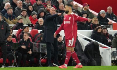 Liverpool's Mohamed Salah, right, and manager Arne Slot gesture during the English Premier League soccer match between Liverpool and Sunderland in Liverpool, Wednesday, Dec. 3, 2025. (AP Photo/Jon Super)