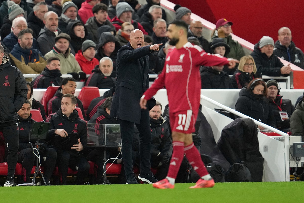 Liverpool's Mohamed Salah, right, and manager Arne Slot gesture during the English Premier League soccer match between Liverpool and Sunderland in Liverpool, Wednesday, Dec. 3, 2025. (AP Photo/Jon Super)