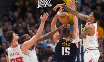 Denver Nuggets center Nikola Jokić, third from left, has his shot blocked by, from left, Houston Rockets center Alperen Sengun and forwards Kevin Durant and Jabari Smith Jr. in overtime of an NBA basketball game Monday, Dec. 15, 2025, in Denver. (AP Photo/David Zalubowski)