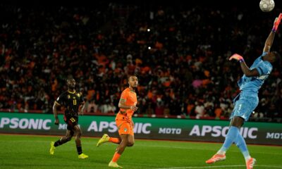Ivory Coast's goalkeeper Yahia Fofana attempts a save during the Africa Cup of Nations group F soccer match between Ivory Coast and Cameroon, in Marrakech, Morocco, Sunday, Dec. 28, 2025. (AP Photo/Themba Hadebe)