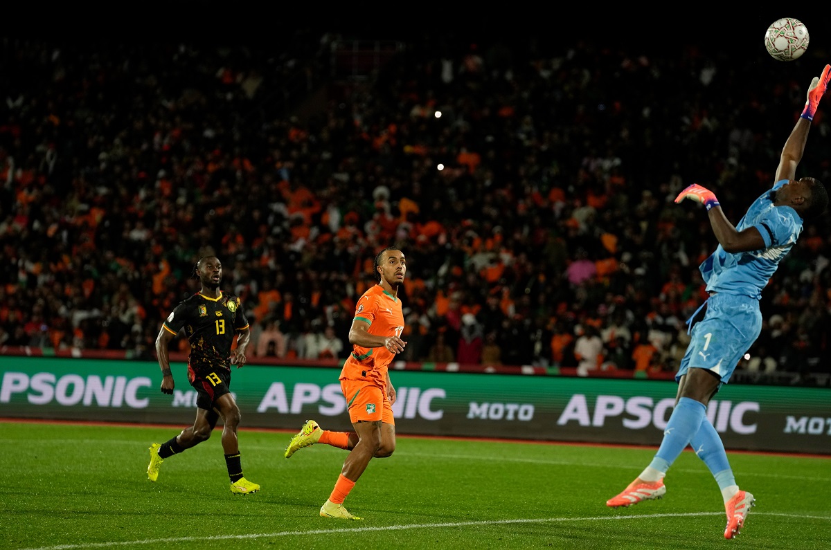 Ivory Coast's goalkeeper Yahia Fofana attempts a save during the Africa Cup of Nations group F soccer match between Ivory Coast and Cameroon, in Marrakech, Morocco, Sunday, Dec. 28, 2025. (AP Photo/Themba Hadebe)