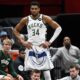 Milwaukee Bucks forward Giannis Antetokounmpo (34) watches the action while resting during the second half of an NBA basketball game against the Washington Wizards, Monday, Dec. 1, 2025, in Washington. (AP Photo/John McDonnell)