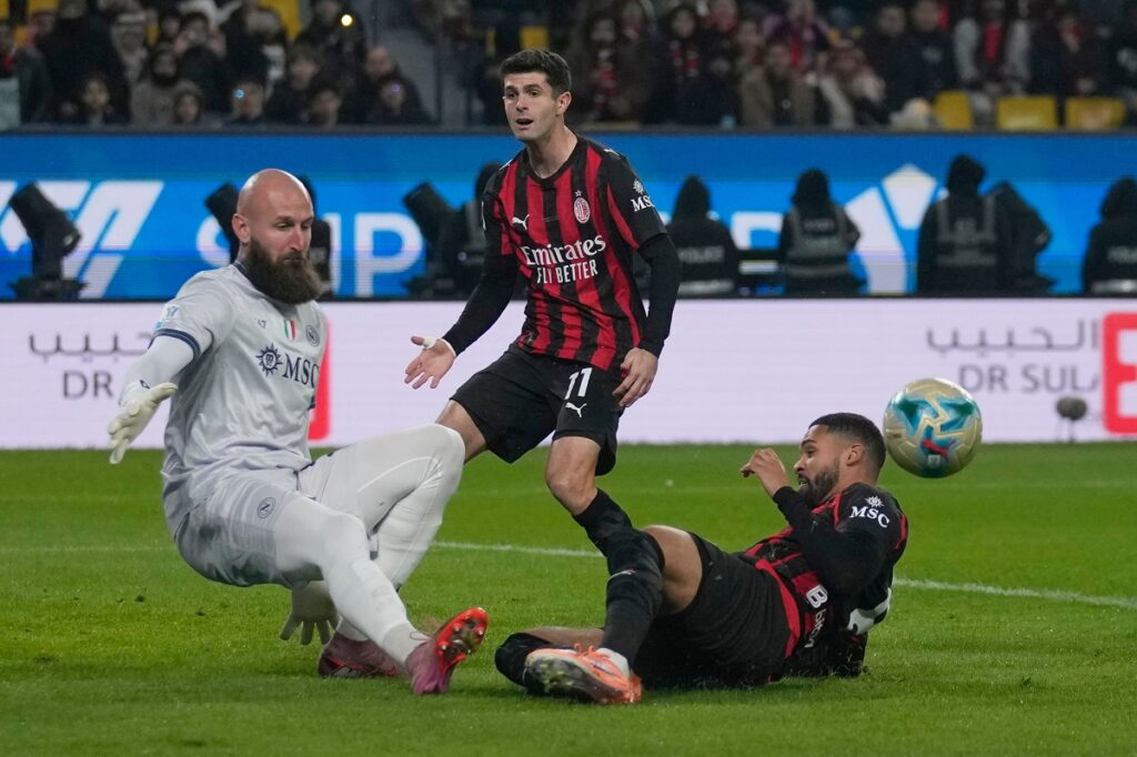 Napoli's Vanja Milinkovic-Savic saves o an attempt to score by AC Milan's Ruben Loftus-Cheek during an Italian Super Cup soccer match between Napoli and AC Milan in Riyadh, Saudi Arabia, Thursday, Dec. 18, 2025. (AP Photo/Altaf Qadri)