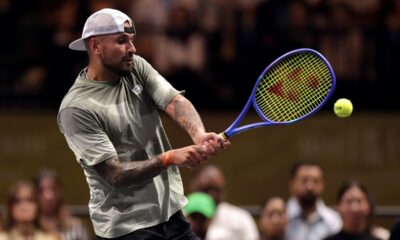 Nick Kyrgios plays a backhand against Aryna Sabalenka during their Battle of the Sexes match in Dubai, United Arab Emirates, Sunday Dec. 28, 2025. (Christopher Pike/Pool Photo via AP)