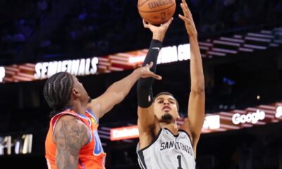 San Antonio Spurs forward Victor Wembanyama (1) shoots the ball near Oklahoma City Thunder guard Jalen Williams (8) in the second half of an NBA Cup semifinals basketball game, Saturday, Dec. 13, 2025, in Las Vegas. (AP Photo/Ronda Churchill)