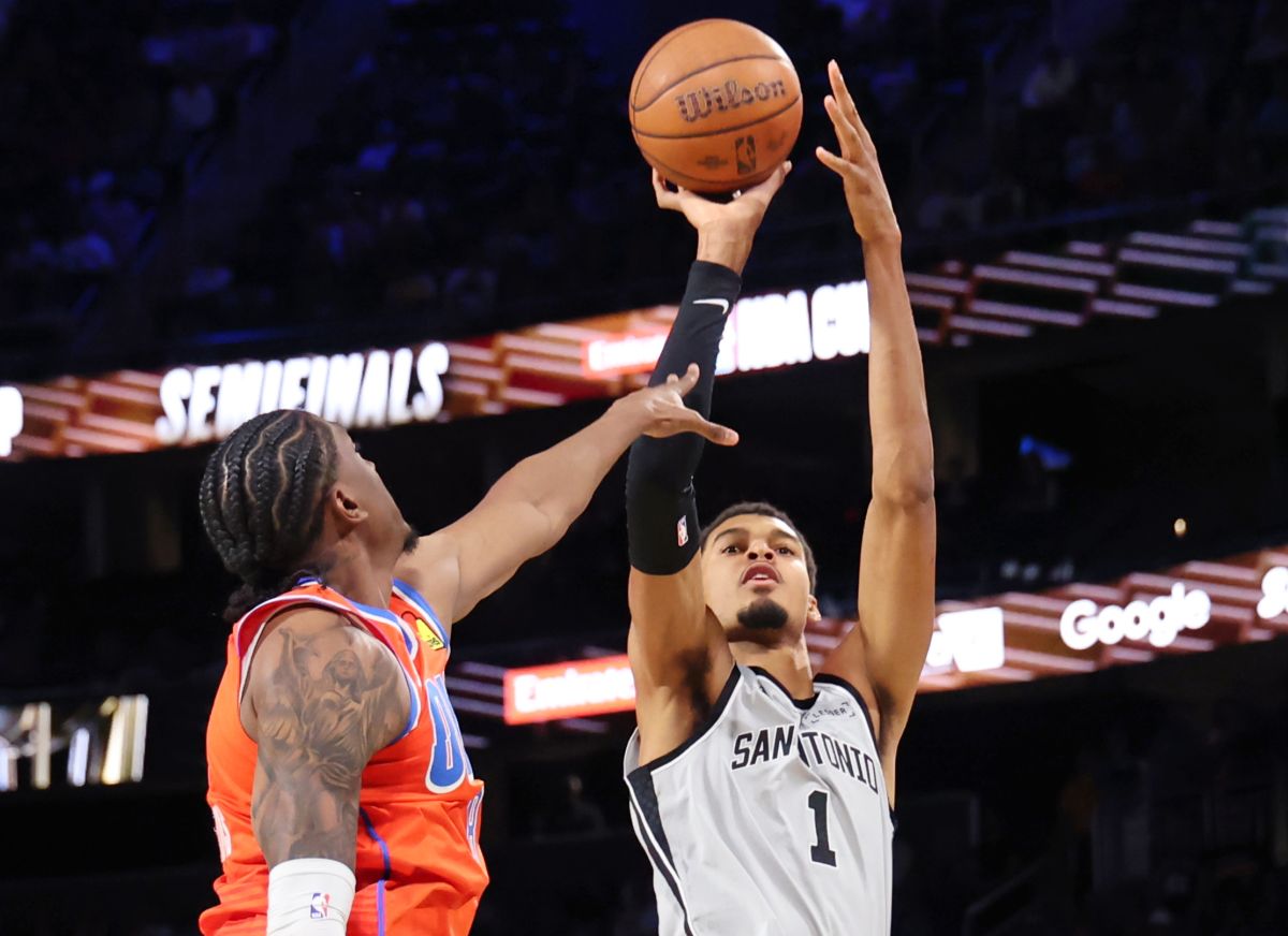 San Antonio Spurs forward Victor Wembanyama (1) shoots the ball near Oklahoma City Thunder guard Jalen Williams (8) in the second half of an NBA Cup semifinals basketball game, Saturday, Dec. 13, 2025, in Las Vegas. (AP Photo/Ronda Churchill)