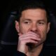 Real Madrid's head coach Xabi Alonso sits at the bench before a Champions League opening phase soccer match between Real Madrid and Manchester City, in Madrid, Spain, Wednesday, Dec. 10, 2025. (AP Photo/Manu Fernandez)
