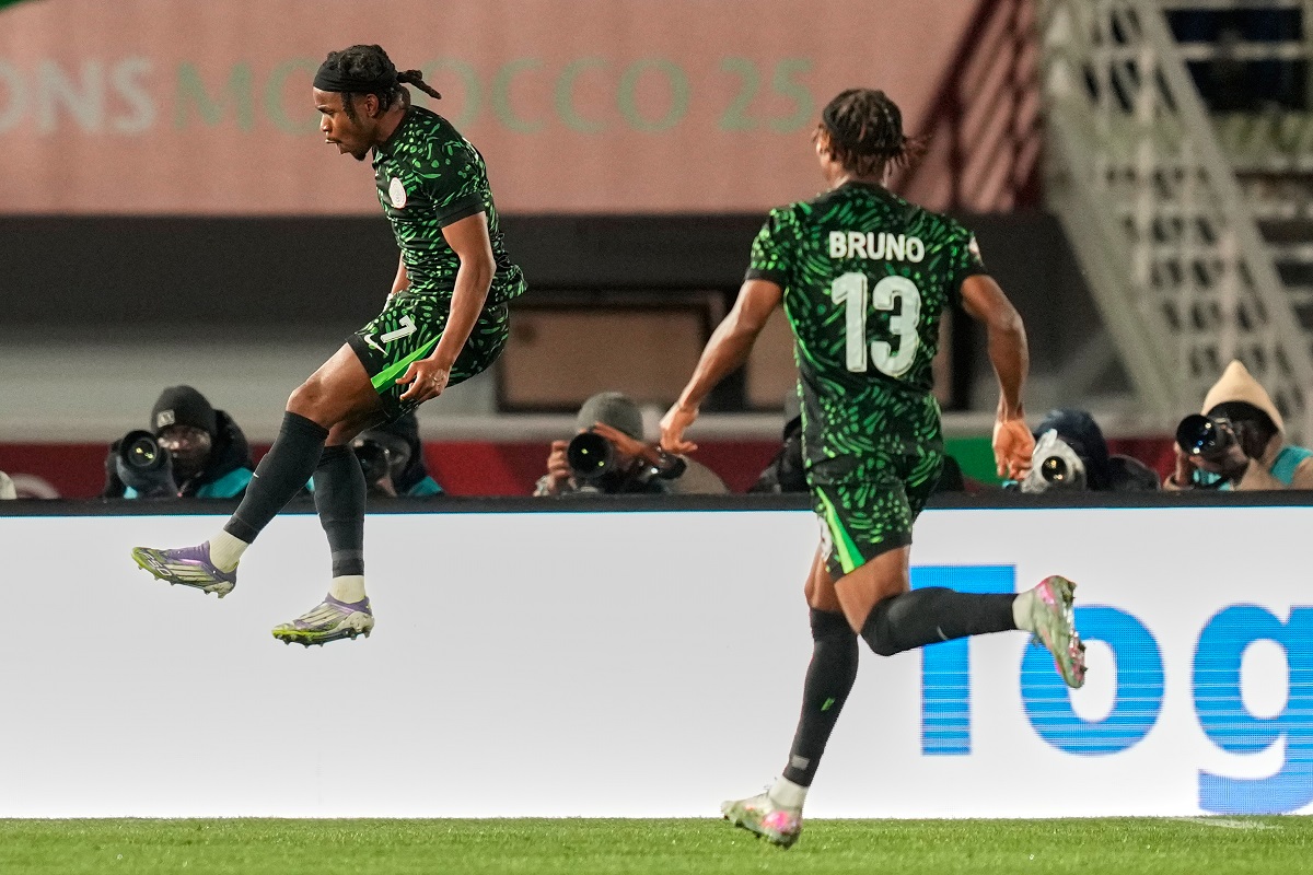 Nigeria's Ademola Lookman, left, celebrates after scoring his side's third goal during the Africa Cup of Nations group C soccer match between Nigeria and Tunisia in Fez, Morocco, Saturday, Dec. 27, 2025. (AP Photo/Mosa'ab Elshamy)