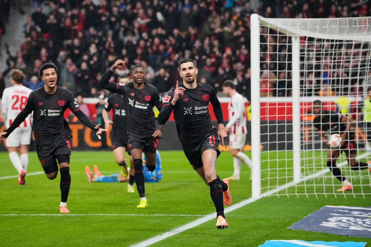Leverkusen's Martim Terrier celebrates after he scored the opening goal during the German Bundesliga soccer match between Bayer 04 Leverkusen and 1.FC Cologne in Leverkusen, Germany, Saturday, Dec. 13, 2025. (AP Photo/Martin Meissner)