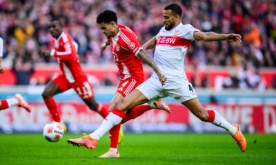 Munich's Luis Diaz, left, and Stuttgart's Josha Vagnoman, right, challenge for the ball during the German Bundesliga soccer match between VfB Stuttgart and FC Bayern Munich in Stuttgart, Germany, Saturday, Dec. 6, 2025. (Tom Weller/dpa via AP)