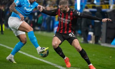 AC Milan's Strahinja Pavlovic challenges for the ball with Napoli's Giovanni Di Lorenzo during an Italian Super Cup soccer match between Napoli and AC Milan in Riyadh, Saudi Arabia, Thursday, Dec. 18, 2025. (AP Photo/Altaf Qadri)