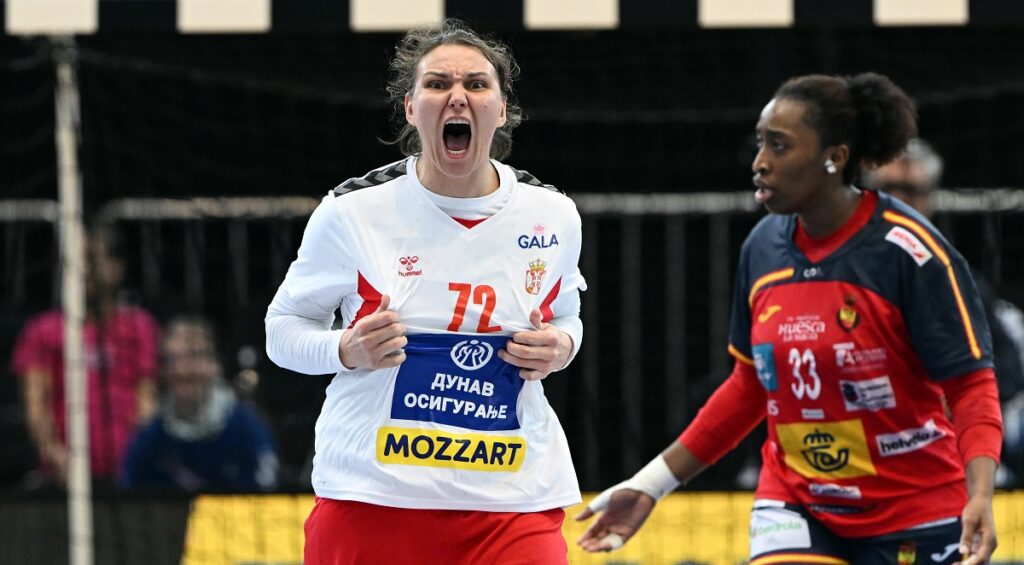 Serbia's Dragana Cvijic, front, celebrates after the women's handball World Championship match between Spain and Serbia in Dortmund, Germany, Tuesday, Dec. 2, 2025. (Federico Gambarini/dpa via AP)