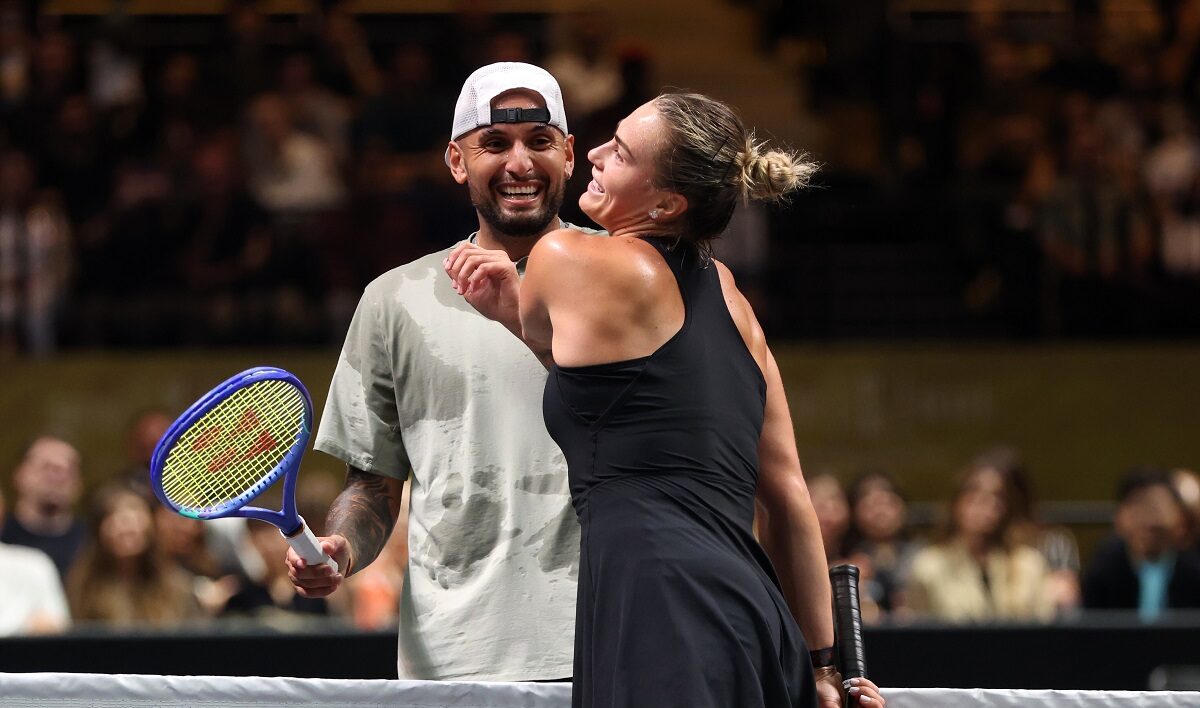 Nick Kyrgios, left, and Aryna Sabalenka interact at the net during their Battle of the Sexes match, in Dubai, United Arab Emirates, Sunday Dec. 28, 2025. (Christopher Pike/Pool Photo via AP)