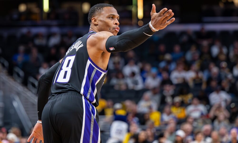 Sacramento Kings guard Russell Westbrook reacts after scoring during the first half of an NBA basketball game against the Indiana Pacers in Indianapolis, Monday, Dec. 8, 2025. (AP Photo/Doug McSchooler)