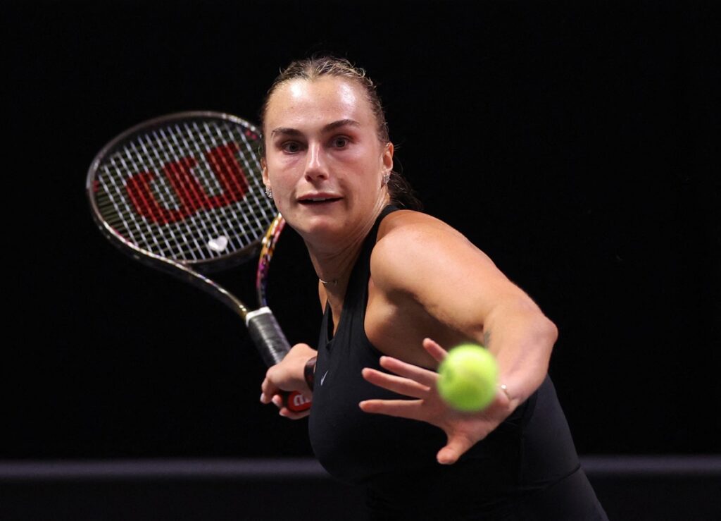 Aryna Sabalenka plays a forehand against Nick Kyrgios during their Battle of the Sexes tennis match, in Dubai, United Arab Emirates, Sunday Dec. 28, 2025. (Amr Alfiky/Pool Photo via AP)