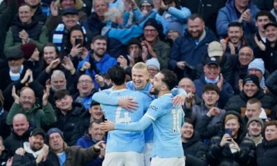 Manchester City's Erling Haaland, center, celebrates with teammates after scoring the opening goal of the game during the English Premier League soccer match between Manchester City and West Ham United in Manchester, England, Saturday, Dec. 20, 2025. (AP Photo/Dave Thompson)