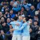 Manchester City's Erling Haaland, center, celebrates with teammates after scoring the opening goal of the game during the English Premier League soccer match between Manchester City and West Ham United in Manchester, England, Saturday, Dec. 20, 2025. (AP Photo/Dave Thompson)