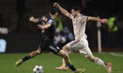 Qarabag's Matheus Silva, left, and Ajax's Raul Moro fight for the ball during the Champions League opening phase soccer match between Qarabag and Ajax in Baku, Azerbaijan, Wednesday, Dec. 10, 2025. (AP Photo)