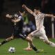 Qarabag's Matheus Silva, left, and Ajax's Raul Moro fight for the ball during the Champions League opening phase soccer match between Qarabag and Ajax in Baku, Azerbaijan, Wednesday, Dec. 10, 2025. (AP Photo)
