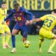 Barcelona's Lamine Yamal, center, vies for the ball with Villarreal's Sergi Cardona during the Spanish La Liga soccer match between Villarreal and Barcelona in Villarreal, Spain, Sunday, Dec. 21, 2025. (AP Photo/Alberto Saiz)